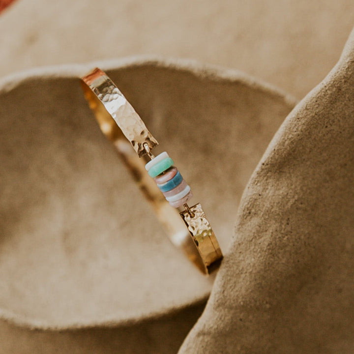 14k gold plated bangle with hammered texture, natural stones in the middle