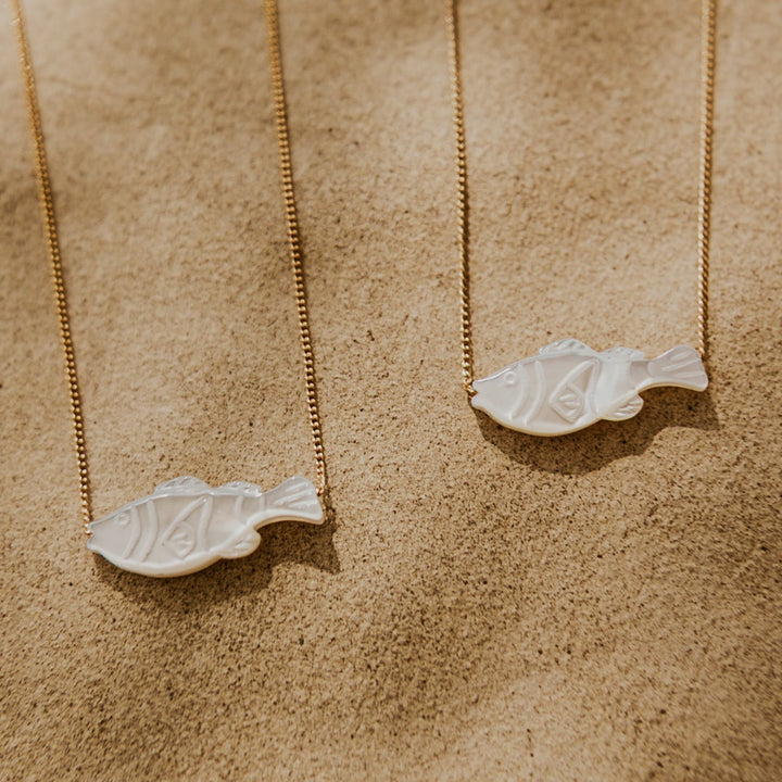 mother of pearl fish pendent on thin gold chain