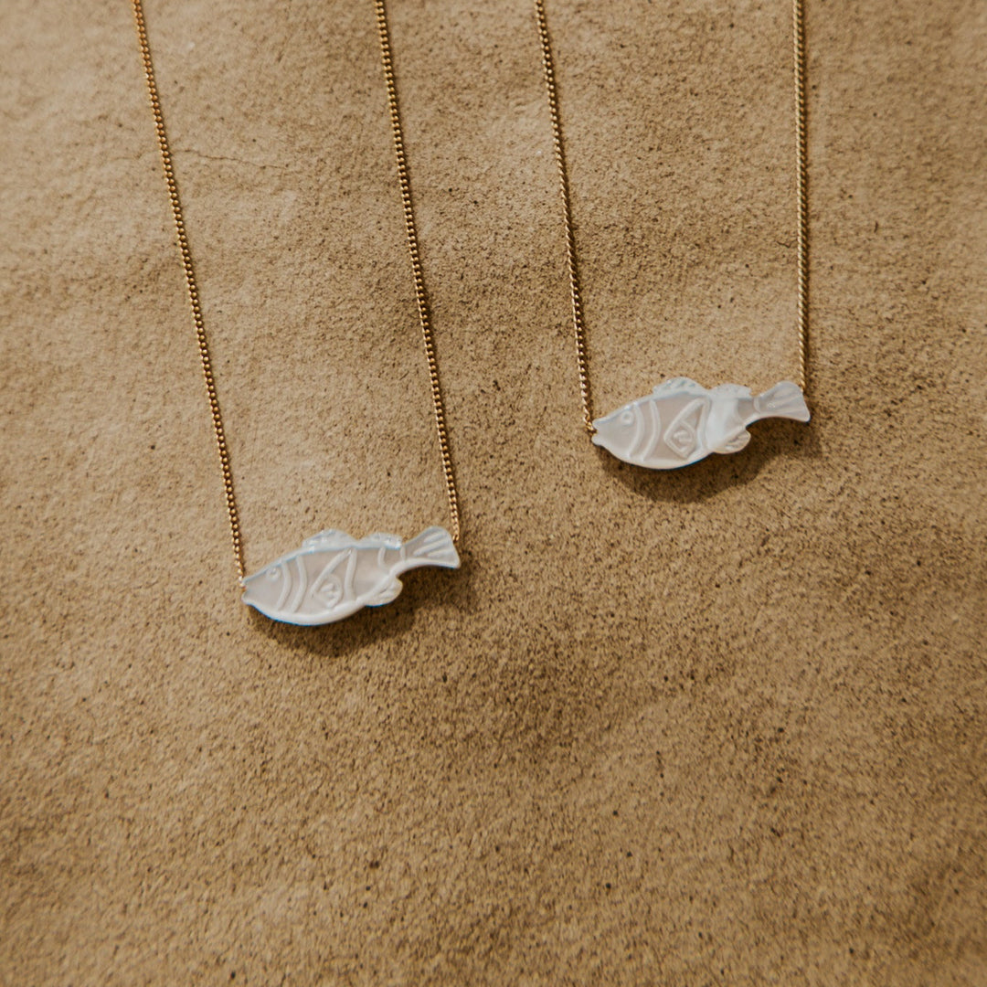 mother of peal fish pendents on thin 14k gold platted chain