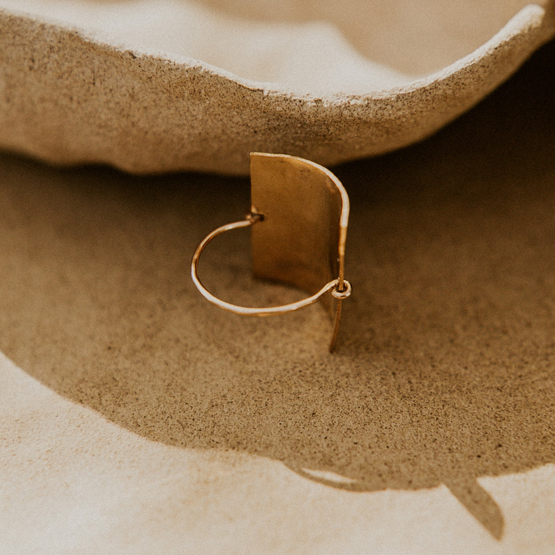 the back of a gold rectangular ring