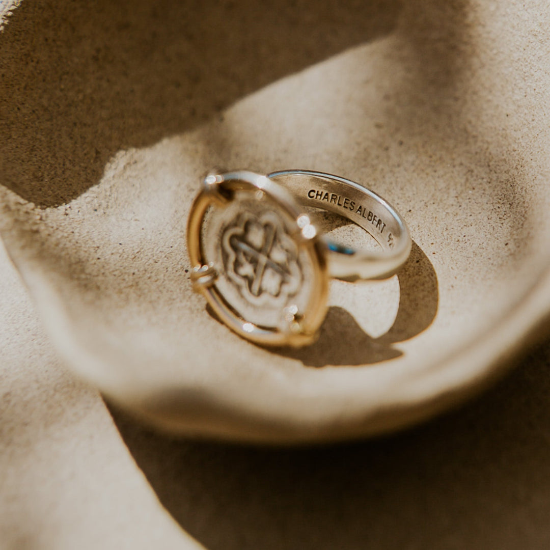 silver coin ring with gold 