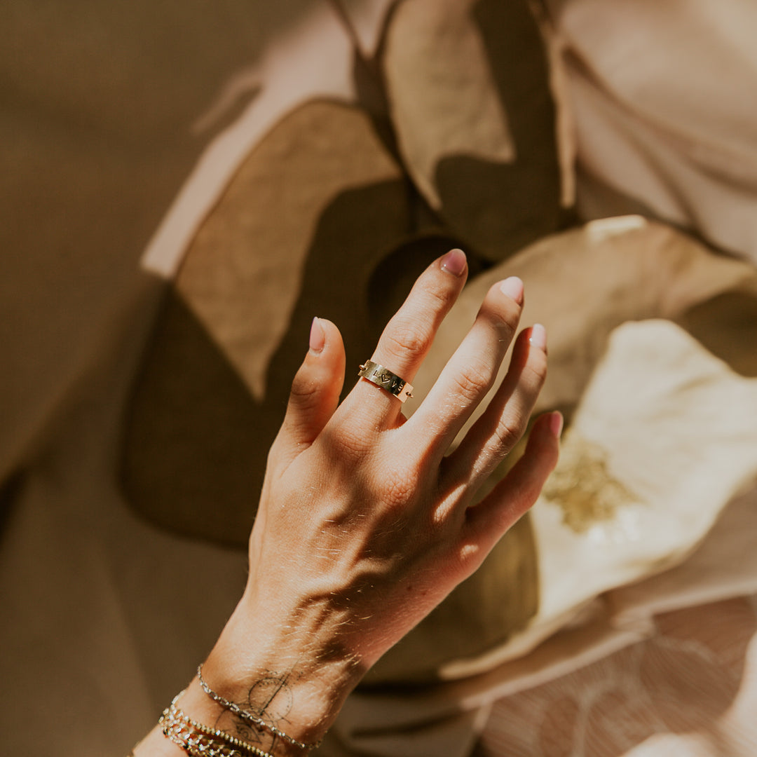 hand stamped 14k gold fill ring with "love" on it 
