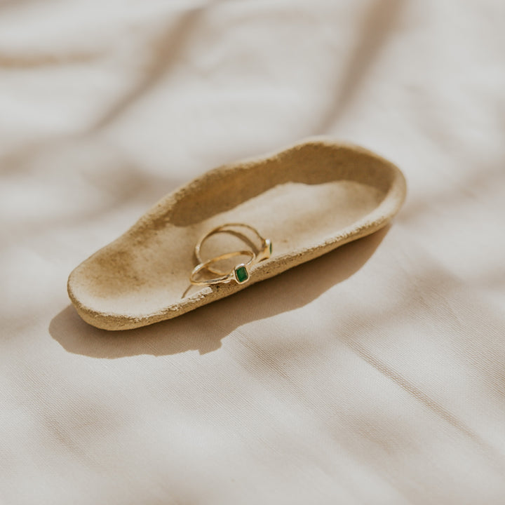 delicate 14k gold band with green emerald gemstone