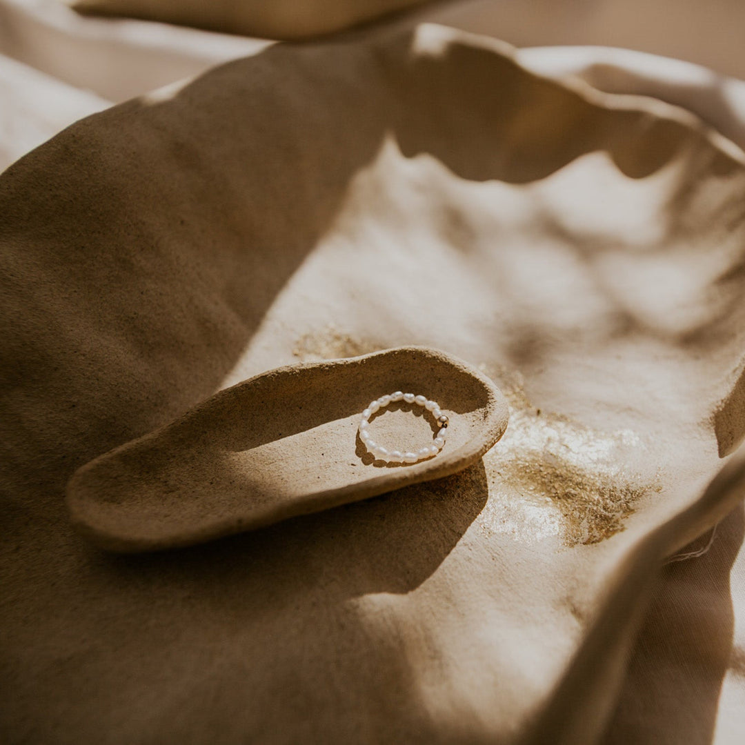 beaded pearl ring with gold bead in middle