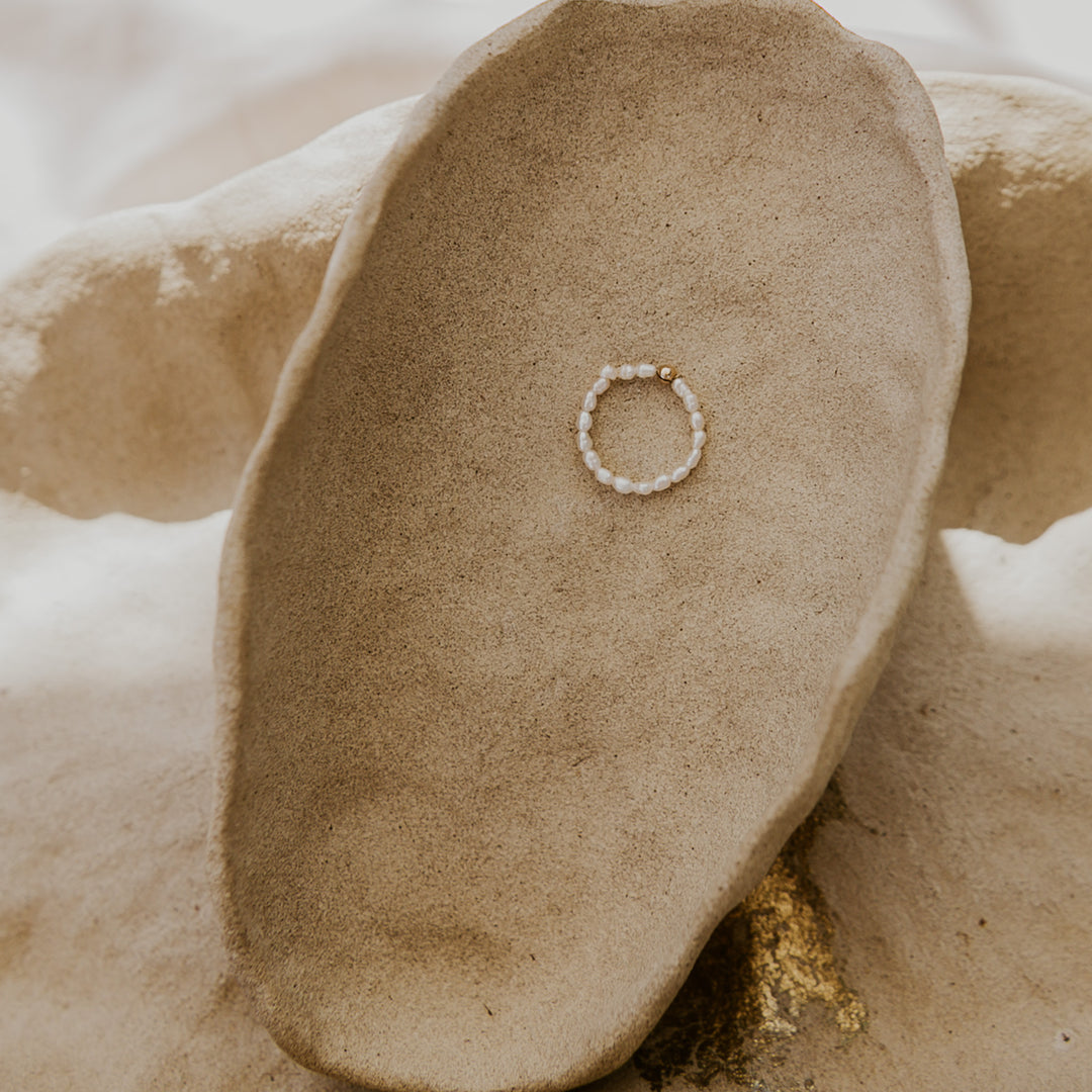 Ring on a textured beige surface