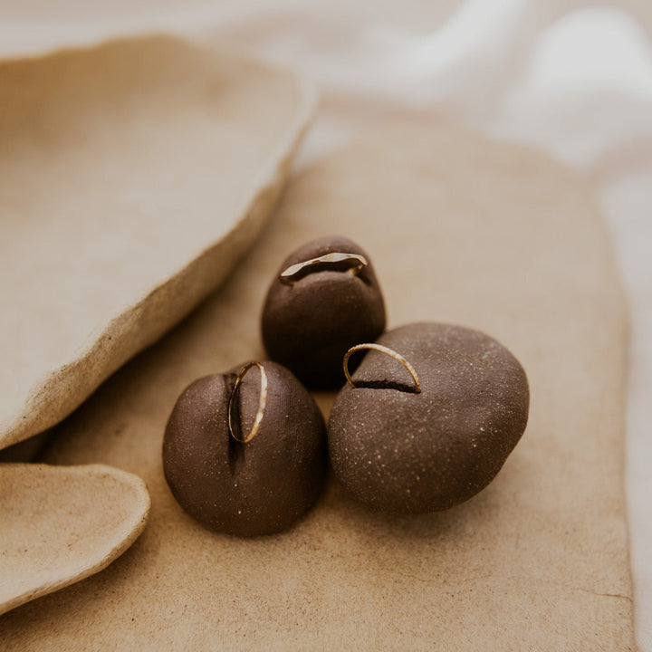 3 14k gold fill rings with different hammered textures stacked 