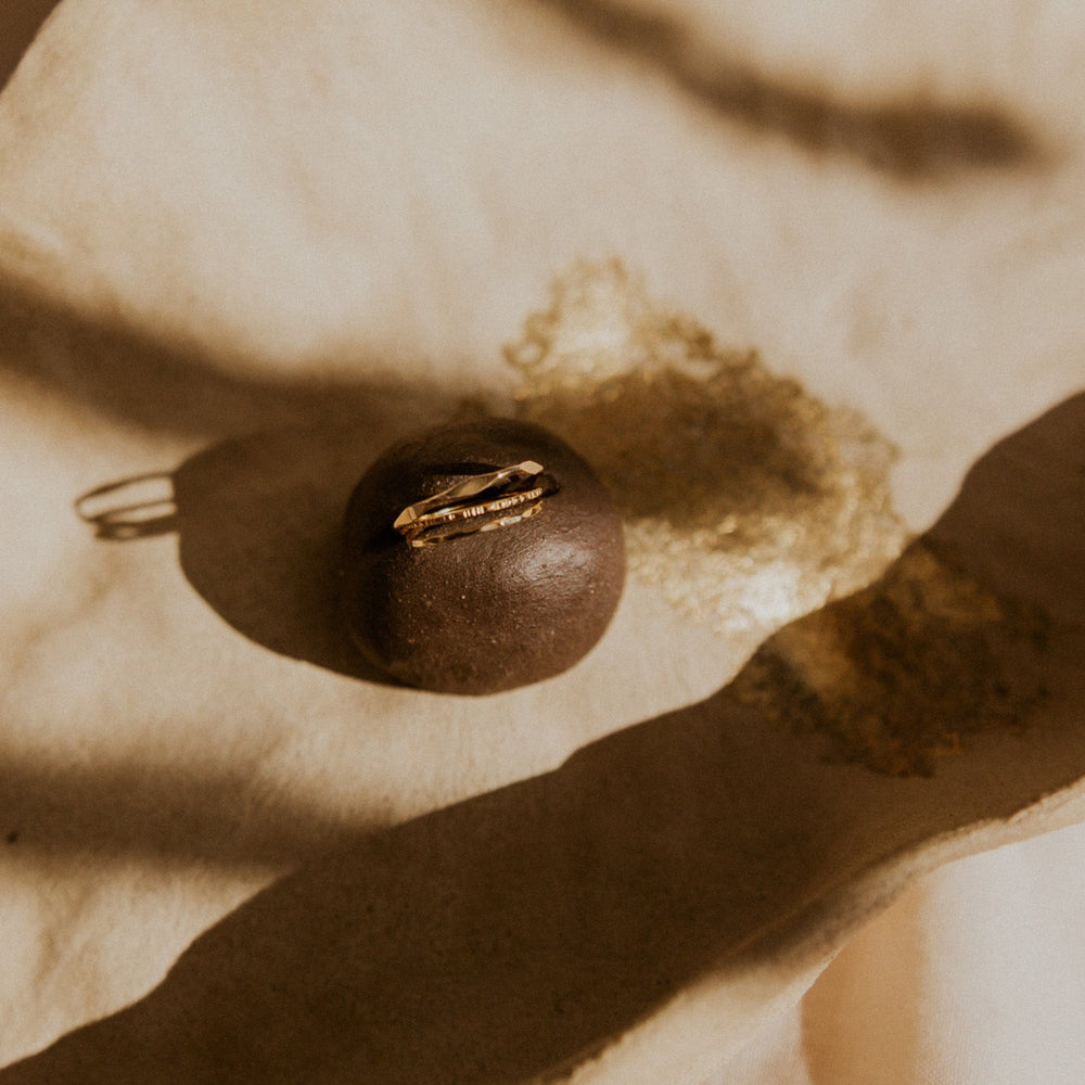 3 14k gold fill rings with different hammered textures stacked 