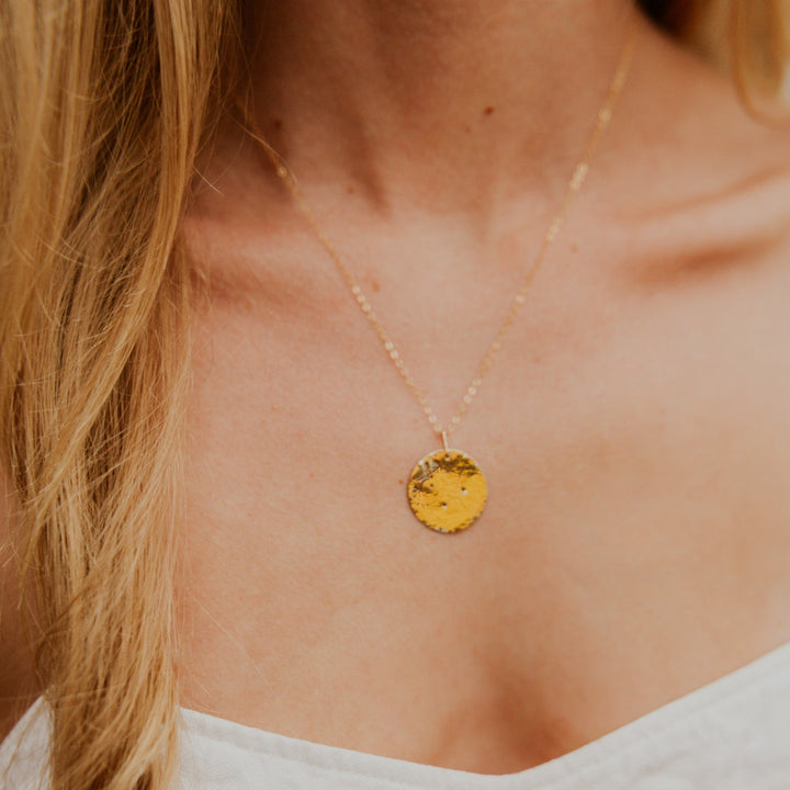 Gold necklace with a 14k gold fill rectangle pendant and small diamond on gold chain 