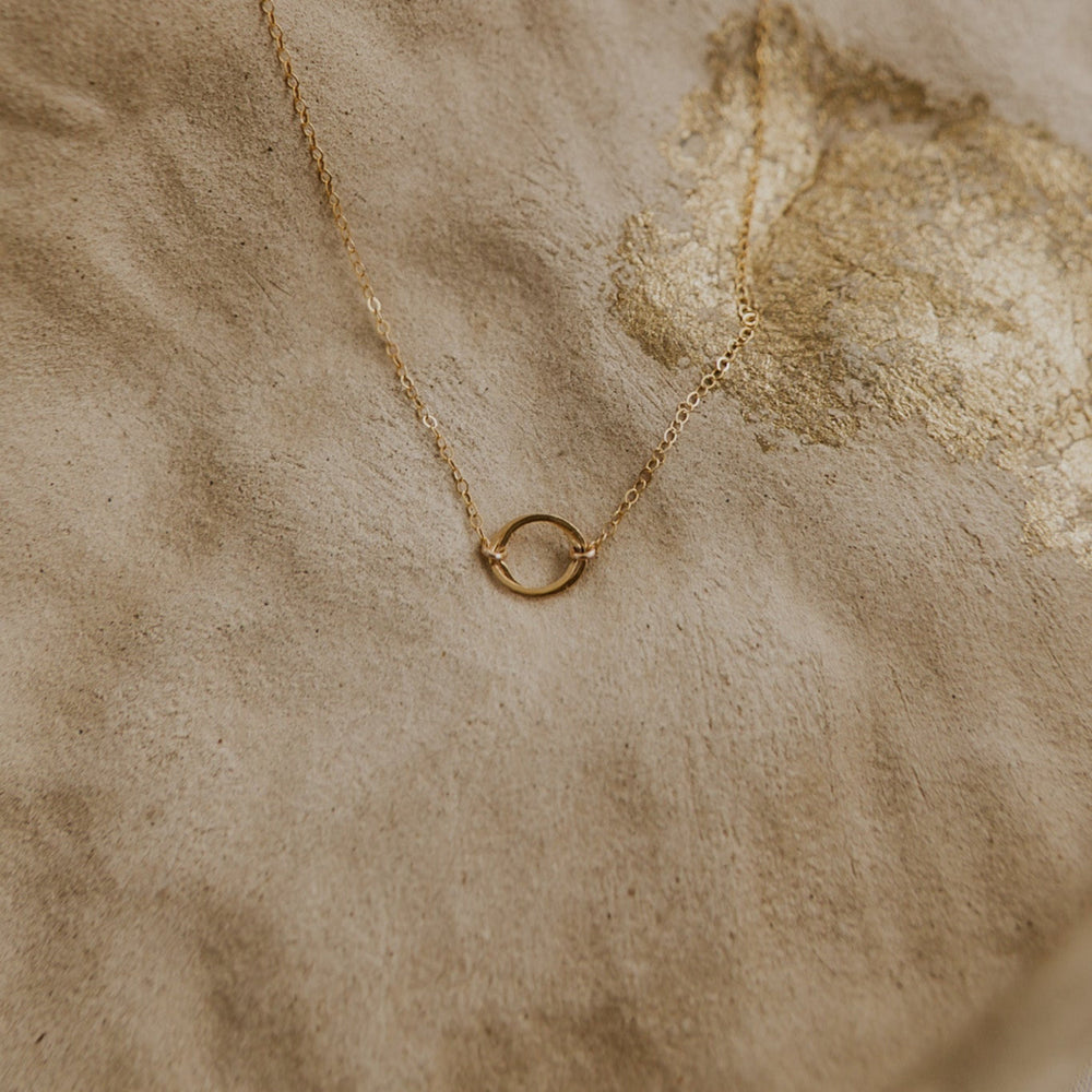 14k Gold fill necklace with two interlocking gold circles on gold chain