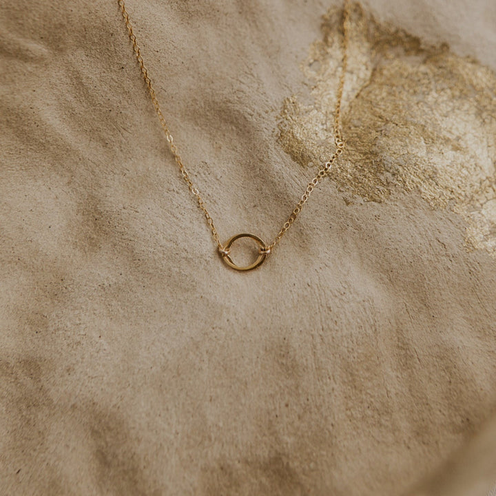 14k Gold fill necklace with two interlocking gold circles on gold chain