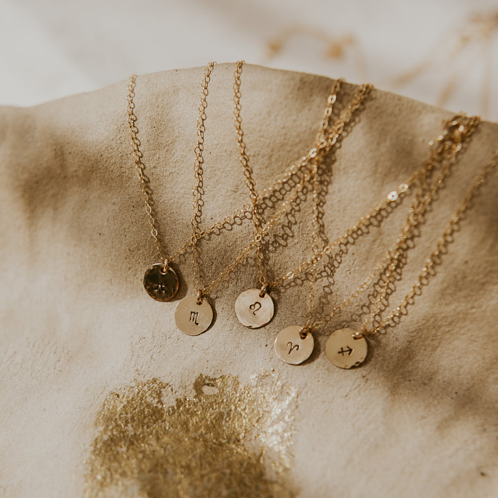 14 gold fill chain with small gold disc with astrological sign stamped on it