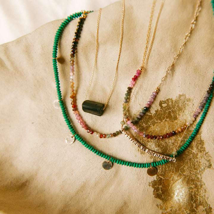 Layered Aurora Necklaces handcrafted in Carlsbad with six inches of multi-color spinel gemstones.