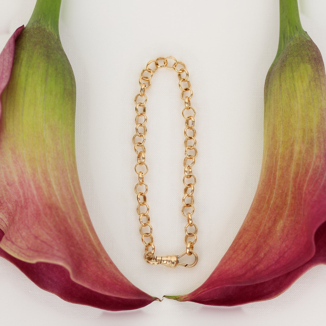 Amelia gold filled chain bracelet laid open to show its full length and swivel clasp