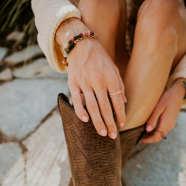 Teressa Lane Jewelry custom gemstone bracelet Carlsbad worn on a stylish hand with a chic outfit