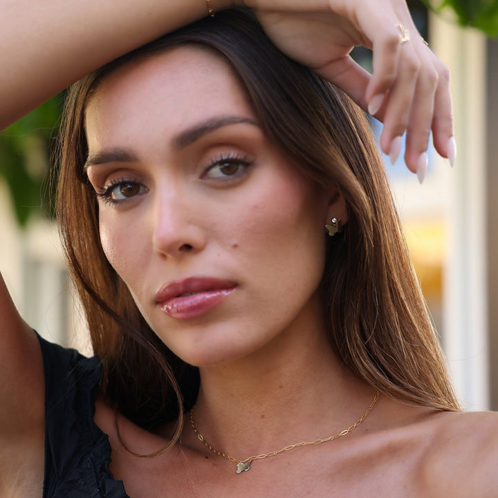 Dolly gold filled butterfly necklace and earrings set worn together, styled with a paperclip chain bracelet