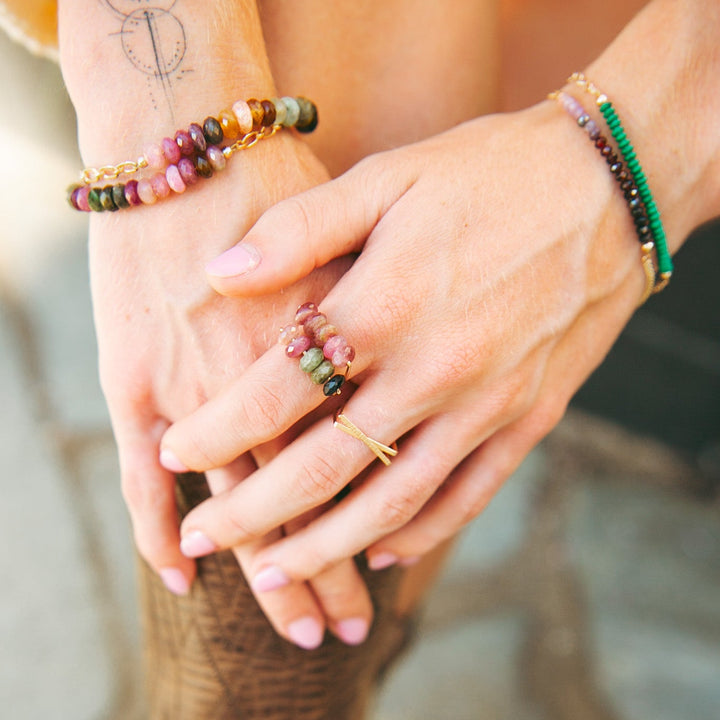 Teressa Lane Jewelry Emma gemstone ring worn on hand with colorful gemstone bracelets