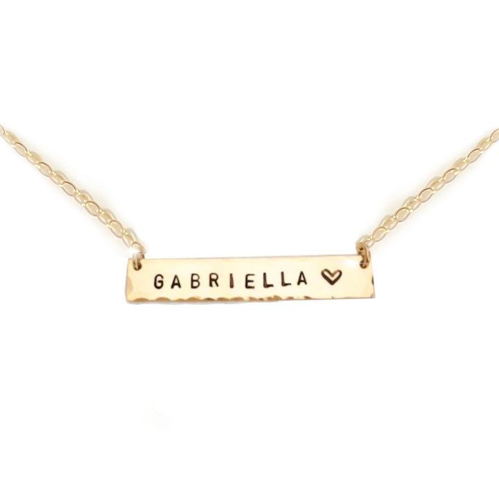 Teressa Lane Jewelry personalized bar necklace in gold with Gabriella engraving and heart detail