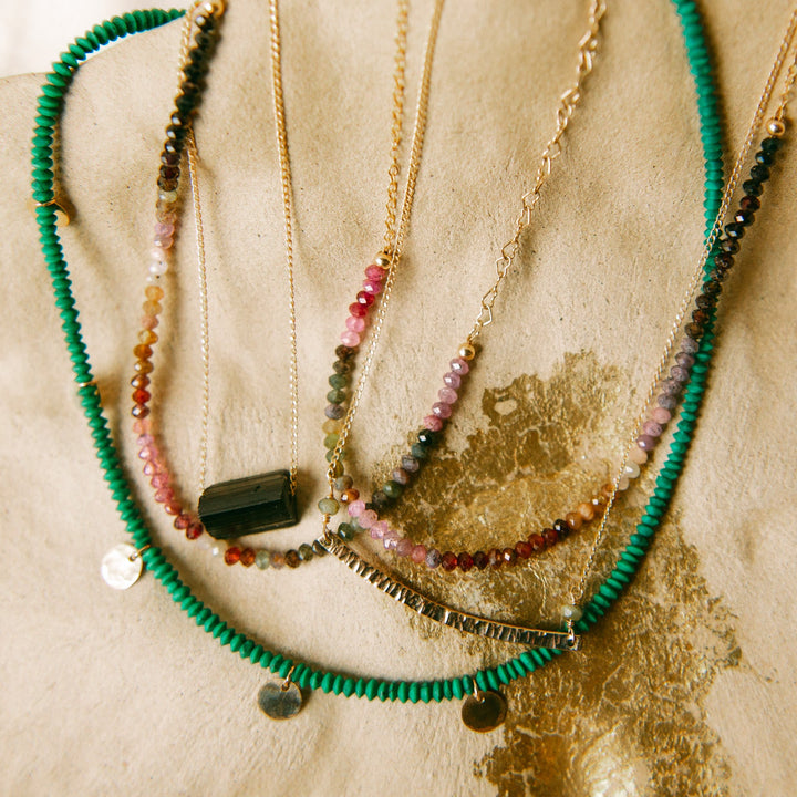 Teressa Lane Jewelry green beaded gold charm necklace layered with colorful gemstones