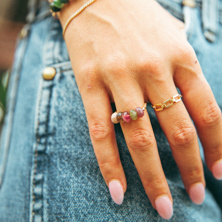 Colorful handmade jewelry Carlsbad ring featuring natural stones worn on a woman's finger