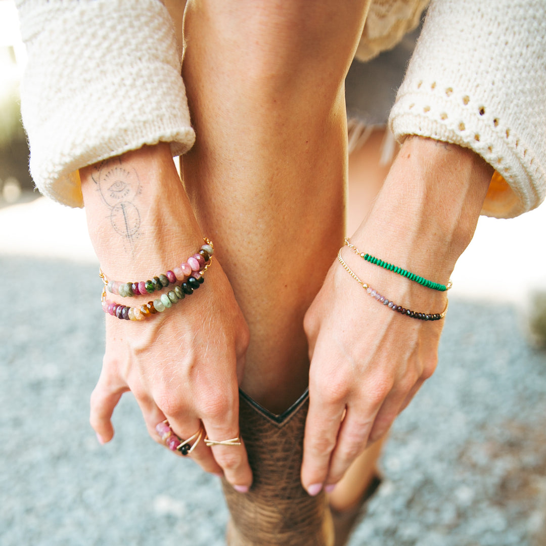 Haven Bracelet handmade carlsbad shown on a model's wrist with colorful beads and stacked styles