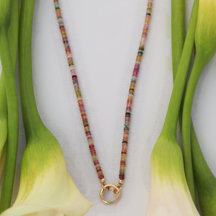 Close-up of the Joy tourmaline beaded necklace finished with a round 14k gold filled clasp at the front
