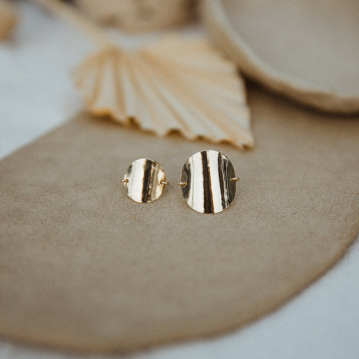 Teressa Lane Jewelry Katie Ring for women set with two polished gold round bands on beige background