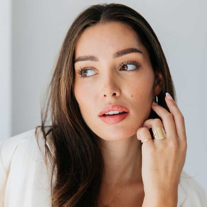 Woman wearing Katie Ring for women by Teressa Lane Jewelry with gold and elegant design