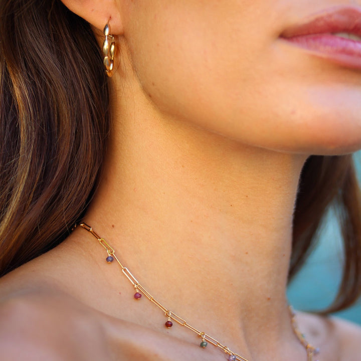 Gold Bead Solace hoop worn with the Juliette spinel paperclip necklace