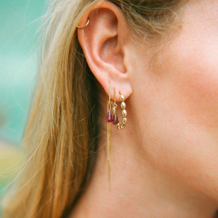 Solace Hoops handmade jewelry featuring gold accents and colorful stones for a unique look