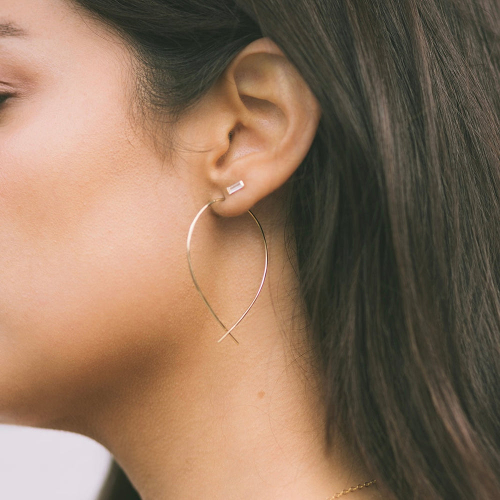 Teressa Lane Jewelry elegant threader earrings for women in gold on model's ear