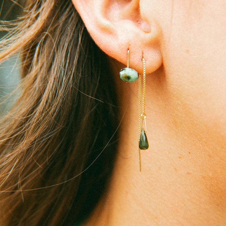 Unique threader earrings handmade by Teressa Lane Jewelry featuring green gemstones and gold chains