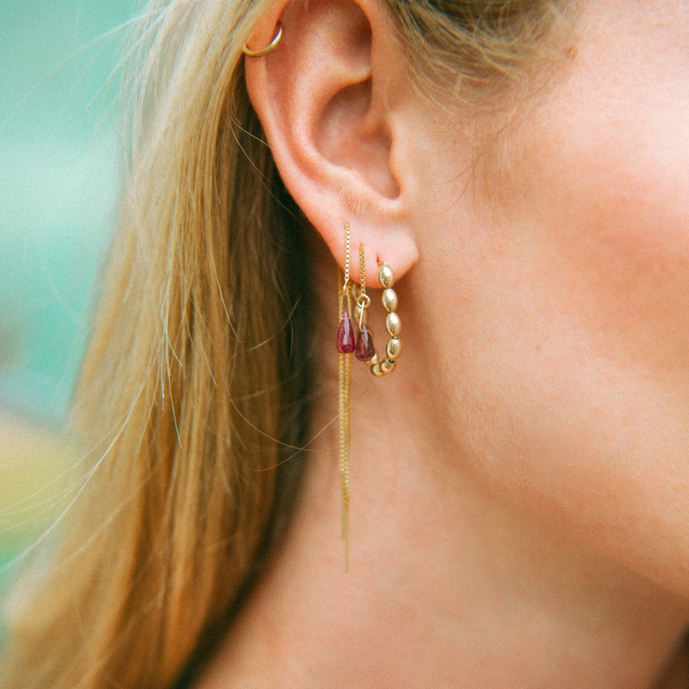 Unique threader earrings handmade by Teressa Lane Jewelry featuring a mix of gold and gemstones