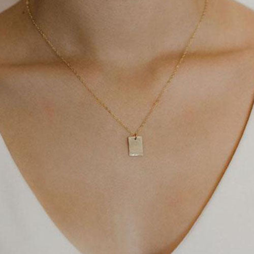 Teressa Lane Jewelry personalized gold necklace with small rectangular pendant on model