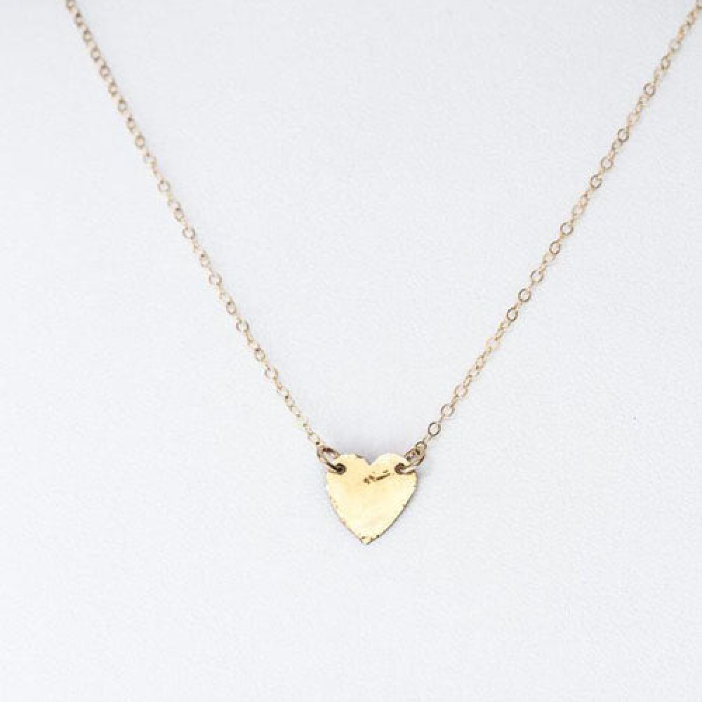 Teressa Lane Jewelry delicate gold heart necklace with a small textured pendant on thin chain